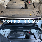 A before and after picture of a Volvo XC90 Engine Detailing