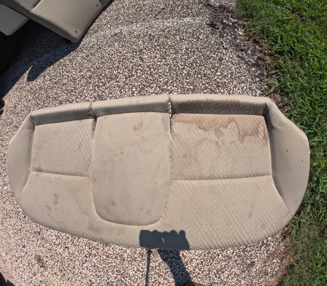 Dirty vehicle upholstery before shampoo extraction Maple Shade NJ
