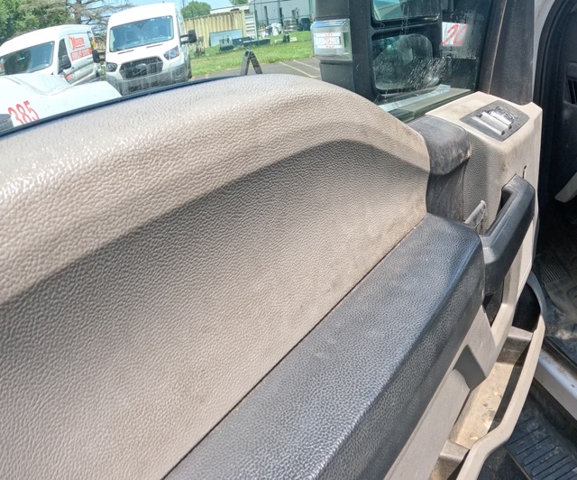 Dirty vehicle door panel before detailing in Marlton NJ