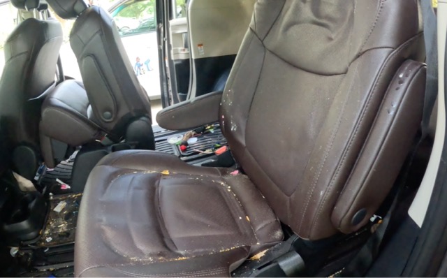 Dirty leather seats before interior restoration in Moorestown New Jersey