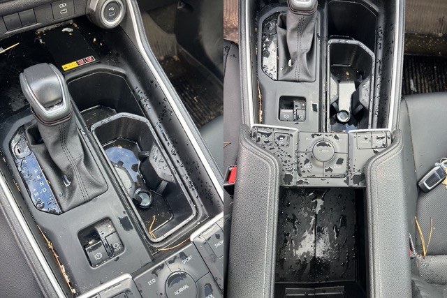 Vehicle center console undergoing detailed interior cleaning